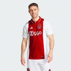 Koszulka Ajax Amsterdam 24/25 Home. Białe t-shirty sportowe męskie Adidas, s, z materiału, bez ramiączek, do piłki nożnej. W wyprzedaży za 314.30 zł.