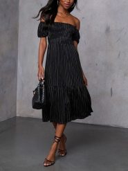 LA Angels Sukienka w kolorze czarnym rozmiar: L. Czarne sukienki damskie LA Angels, l, bez wzorów, z wiskozy, bez kołnierzyka, bez ramiączek, midi. Za 184.02 zł.