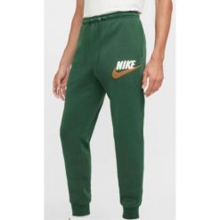 Męskie Dresy Nike. Zielone spodnie dresowe męskie Nike, bez wzorów, z dresówki. Za 276.99 zł.