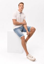 Jasnoniebieskie szorty jeansowe E-MEXT. Niebieskie szorty męskie Volcano, z jeansu, bez kołnierzyka. Za 159.99 zł.