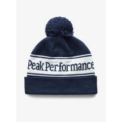 Czapka zimowa Peak Performance Pow Hat - blue shadow/offwhite. Niebieskie czapki męskie Peak Performance, na zimę, bez wzorów, sportowe. Za 161.99 zł.