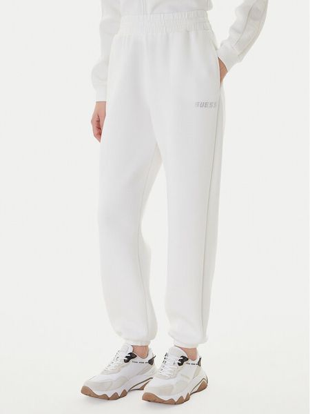 Guess Spodnie dresowe Cecilia V4BB13 K7UW2 Biały Regular Fit. Białe spodnie dresowe damskie Guess, m, z aplikacjami, z dresówki. Za 189.99 zł.