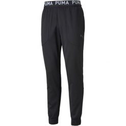 Spodnie męskie Puma TRAIN PWR. Czarne spodnie materiałowe męskie Puma, bez wzorów, z materiału, eleganckie. Za 254.35 zł.