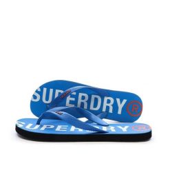 Superdry Klapki Core Essential z gumy – SURF BLUE. Niebieskie klapki i japonki męskie Superdry., z gumy. Za 108.30 zł.