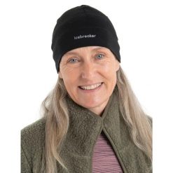 Czapka Zimowa Unisex Icebreaker Mer 200 Oasis Beanie. Czarne czapki męskie Icebreaker, na zimę, bez wzorów, z wełny, sportowe. Za 116.19 zł.