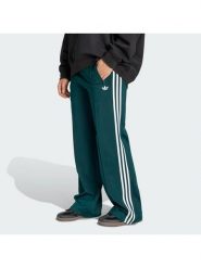 Adidas Spodnie dresowe Firebird KG3701 Zielony Loose Fit. Zielone spodnie dresowe damskie Adidas, xs, bez wzorów, z dresówki. Za 299.99 zł.