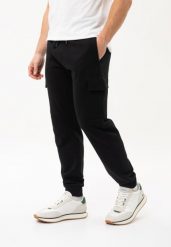 Joggery cargo N-CAVE. Czarne spodnie dresowe męskie Volcano, bez wzorów, z dresówki. Za 149.99 zł.