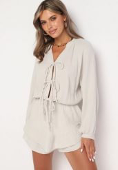 Beżowy Wiązany Bawełniany Kombinezon Boho z Falbankami i Wiązaniem Lalelia. Brązowe kombinezony damskie Born2be, na lato, uniwersalny, bez wzorów, z bawełny, boho, bez kołnierzyka, bez ramiączek. Za 169.99 zł.