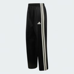 LUŹNE SPODNIE STADIUM BEZ MANKIETÓW. Czarne spodnie materiałowe męskie Adidas, bez wzorów, z bawełny. Za 329.00 zł.
