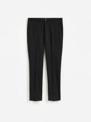 Garniturowe spodnie slim fit - czarny. Czarne spodnie wizytowe męskie Reserved, z tkaniny. Za 169.99 zł.