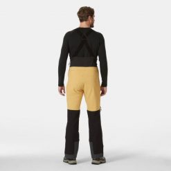 Spodnie narciarskie z szelkami Helly Hansen Odin BC Softshell. Brązowe spodnie materiałowe męskie Helly Hansen, bez wzorów, z softshellu, sportowe. Za 1,535.50 zł.