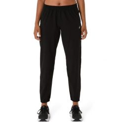 Damskie spodnie dresowe Asics Core. Czarne spodnie sportowe damskie Asics, s, z dresówki, na fitness i siłownię. Za 324.00 zł.