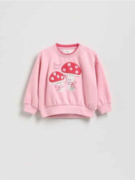 Bluza z aplikacją - pastelowy róż. Czerwone bluzy i bluzki niemowlęce Reserved, z aplikacjami, z bawełny, bez ramiączek, bez kaptura. Za 49.99 zł.