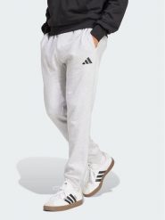 Adidas Spodnie dresowe Essentials Feelcozy Fleece JE3819 Szary jasny Regular Fit. Szare spodnie dresowe męskie Adidas, bez wzorów, z dresówki. Za 219.99 zł.