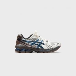 Uniseksowe buty do biegania ASICS GEL-KAYANO 14 Cream / Blue Coast. Białe obuwie do biegania damskie Asics, asics gel kayano. Za 738.00 zł.