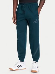 Adidas Spodnie dresowe Z.N.E. JW4724 Zielony Loose Fit. Zielone spodnie dresowe męskie Adidas, bez wzorów, z dresówki. Za 299.99 zł.