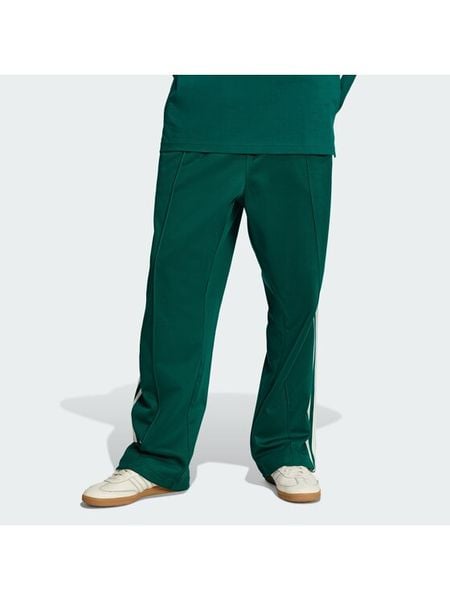 Adidas Spodnie dresowe adicolor KE3497 Zielony Loose Fit. Zielone spodnie dresowe męskie Adidas, bez wzorów, z bawełny. Za 279.99 zł.