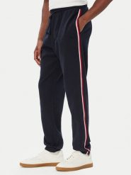 Tommy Hilfiger Spodnie dresowe UM0UM03944 Granatowy Regular Fit. Niebieskie spodnie dresowe męskie Tommy Hilfiger, bez wzorów, z bawełny. Za 369.99 zł.