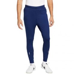 Męskie Spodnie Do Biegania ThermaFit Strike. Niebieskie spodnie sportowe męskie Nike. Za 315.99 zł.