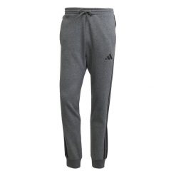 Spodnie do biegania adidas Essentials 3-Stripes Fleece. Szare spodnie sportowe męskie Adidas. Za 303.50 zł.