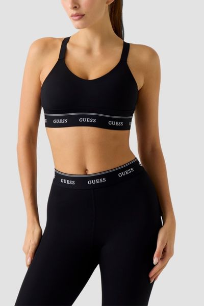 GUESS Czarny damski stanik sportowy Alba, Rozmiar L. Czarne biustonosze sportowe damskie Guess, z aplikacjami. W wyprzedaży za 209.99 zł.