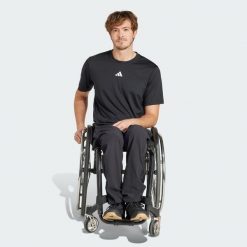 Spodnie Adaptive. Czarne spodnie sportowe męskie Adidas, z materiału. W wyprzedaży za 164.50 zł.