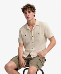 Superdry Koszula krótki rękaw The Merchant Store z fakturowanej bawełny. Brązowe koszule damskie Superdry., m, bez wzorów, z bawełny, eleganckie, bez kołnierzyka, bez ramiączek. Za 336.50 zł.