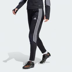 Spodnie Tiro 23 Club Winterized. Czarne spodnie materiałowe damskie Adidas, bez wzorów, z materiału, klasyczne, z standardowym stanem. Za 158.35 zł.