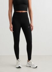 Damskie legginsy z wysokim stanem, odprowadzające pot Sculpting czarne. Czarne legginsy damskie Aim'n, xs, bez wzorów, z lycry. Za 203.40 zł.