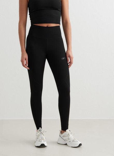 Damskie legginsy z wysokim stanem, odprowadzające pot Sculpting czarne. Czarne legginsy damskie Aim'n, xs, bez wzorów, z lycry. Za 203.40 zł.