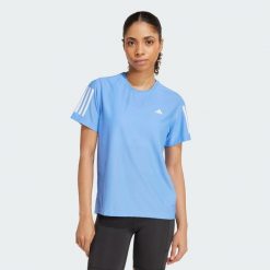 Koszulka Own The Run. Niebieskie t-shirty damskie Adidas, s, bez wzorów, z materiału, bez kołnierzyka. Za 149.00 zł.