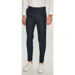 Jack & Jones - Spodnie. Niebieskie spodnie materiałowe męskie Jack & Jones, bez wzorów, z elastanu, eleganckie. W wyprzedaży za 99.90 zł.