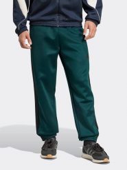 Adidas Spodnie dresowe w kolorze zielonym rozmiar: M. Zielone spodnie dresowe męskie Adidas, bez wzorów, z dresówki. Za 194.95 zł.