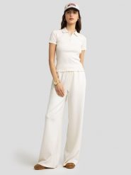 BIG STAR Koszulka polo w kolorze kremowym rozmiar: S. Brązowe bluzki damskie Big Star, s, bez wzorów, z bawełny, retro, bez kołnierzyka, bez ramiączek. Za 79.21 zł.