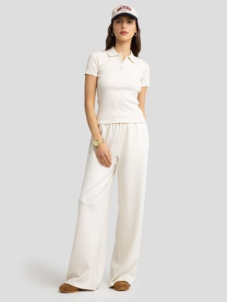 BIG STAR Koszulka polo w kolorze kremowym rozmiar: S. Brązowe bluzki damskie Big Star, s, bez wzorów, z bawełny, retro, bez kołnierzyka, bez ramiączek. Za 79.21 zł.