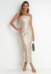 Beżowa Sukienka Satynowa Chrentizo. Brązowe sukienki damskie Born2be, na wesele, l, bez wzorów, z satyny, bez kołnierzyka, bez ramiączek, maxi, kopertowe. Za 99.99 zł.