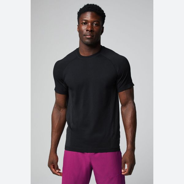 Koszulka Fabletics The Training Day. Niebieskie t-shirty sportowe męskie FABLETICS, l, z materiału, bez ramiączek, na fitness i siłownię. Za 238.00 zł.