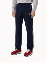 Spodnie do biegania Le Coq Sportif Tri. Niebieskie spodnie sportowe męskie Le Coq Sportif, z dresówki. Za 476.00 zł.
