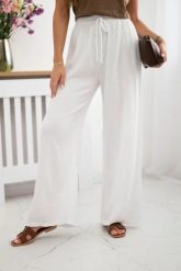 Spodnie muślinowe z szeroką nogawką białe. Białe spodnie materiałowe damskie KESI, bez wzorów, z bawełny, biznesowe, plus size. Za 150.52 zł.