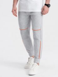 Spodnie męskie dresowe z kontrastowymi przeszyciami - szary melanż V3. Szare spodnie dresowe męskie Ombre Clothing, bez wzorów, z bawełny. W wyprzedaży za 69.99 zł.
