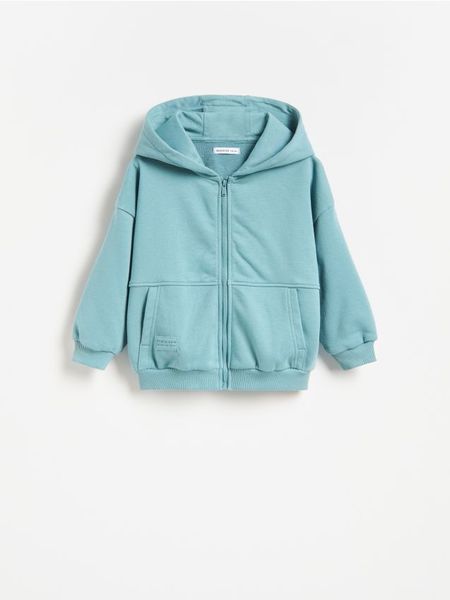 Bawełniana bluza z kapturem - niebieski. Niebieskie bluzy i bluzki niemowlęce Reserved, bez wzorów, z bawełny, bez ramiączek, z kapturem. Za 49.99 zł.