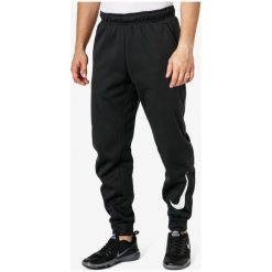 Nike Spodnie Therma Taper Swoosh , czarny, rozmiar L. Czarne spodnie materiałowe męskie Nike, bez wzorów, z dresówki. W wyprzedaży za 159.99 zł.