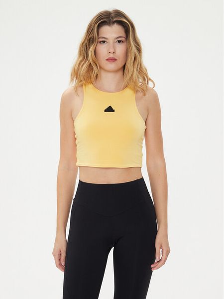 Adidas Top City Escape IS0668 Żółty Slim Fit. Żółte topy damskie Adidas, l, bez wzorów, bez kołnierzyka. Za 89.99 zł.