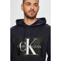 Calvin Klein Jeans - Bluza. Czerwone bluzy z kapturem męskie Calvin Klein Jeans, l, z bawełny. W wyprzedaży za 269.90 zł.