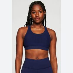 Biustonosz dla kobiet Fabletics Principal High Impact. Niebieskie biustonosze FABLETICS, bez wzorów, z materiału. Za 302.00 zł.