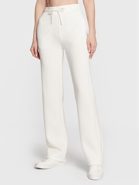 Guess Spodnie dresowe V3RB21 K7UW2 Écru Regular Fit. Spodnie dresowe damskie Guess, xl, z aplikacjami, z dresówki. Za 209.99 zł.