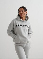 Damska bluza z kapturem, drapany polar, luźny Varsity Sweat Hood szary melanż. Szare bluzy sportowe damskie Aim'n, l, z bawełny. Za 339.00 zł.
