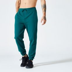 Spodnie dresowe męskie Domyos Gym & Pilates. Czarne spodnie dresowe męskie DOMYOS, z bawełny. Za 99.99 zł.