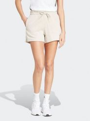 Adidas Szorty w kolorze kremowym rozmiar: S. Brązowe szorty damskie Adidas, bez wzorów. Za 88.02 zł.