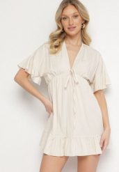 Beżowa Nietoperzowa Sukienka z Wiskozą o Rozkloszowanym Kroju z Falbanką Tullimi. Brązowe sukienki damskie Born2be, na co dzień, uniwersalny, bez wzorów, z wiskozy, eleganckie, bez kołnierzyka, bez ramiączek, mini, kopertowe. W wyprzedaży za 63.99 zł.